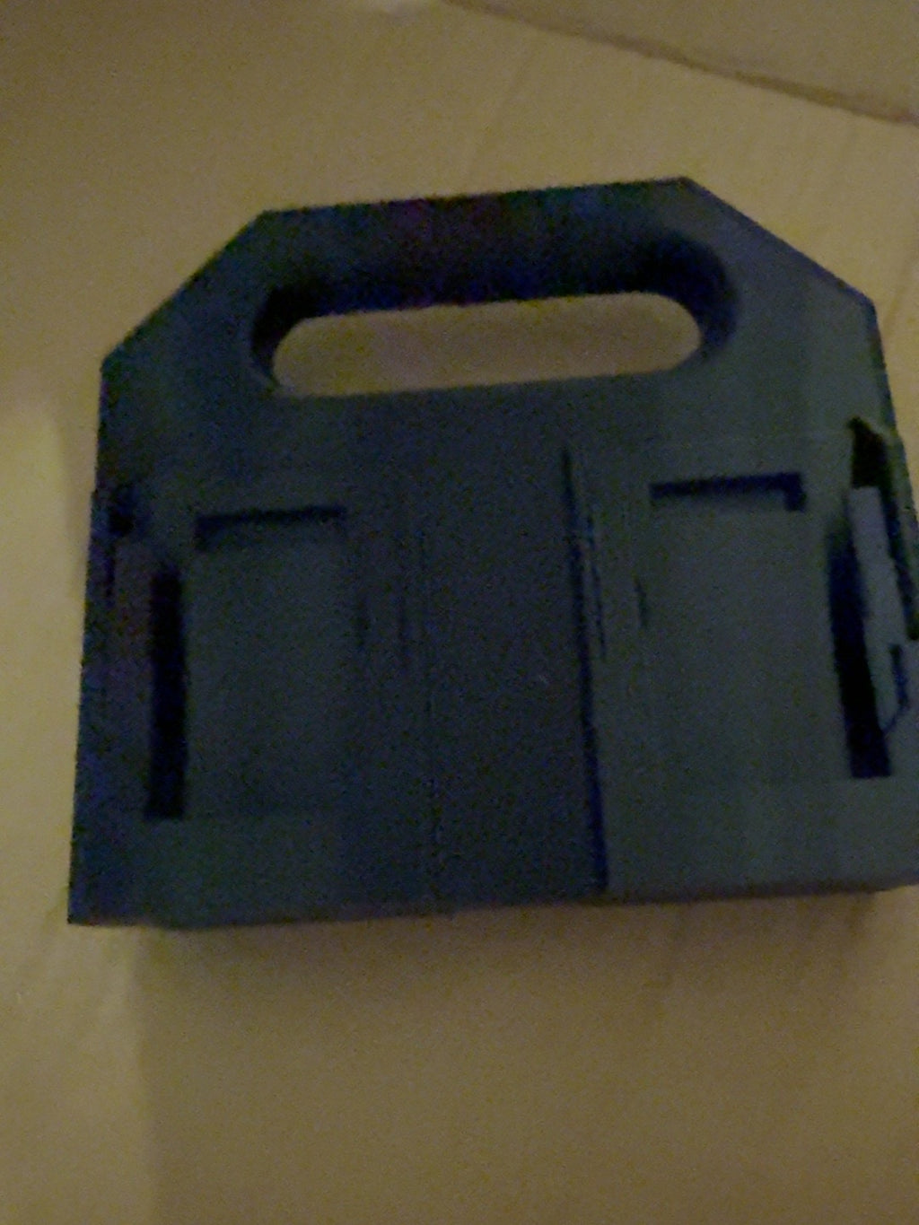 Black PETG four-battery caddy compatible with DEWALT 20V MAX-style batteries, alternate empty view