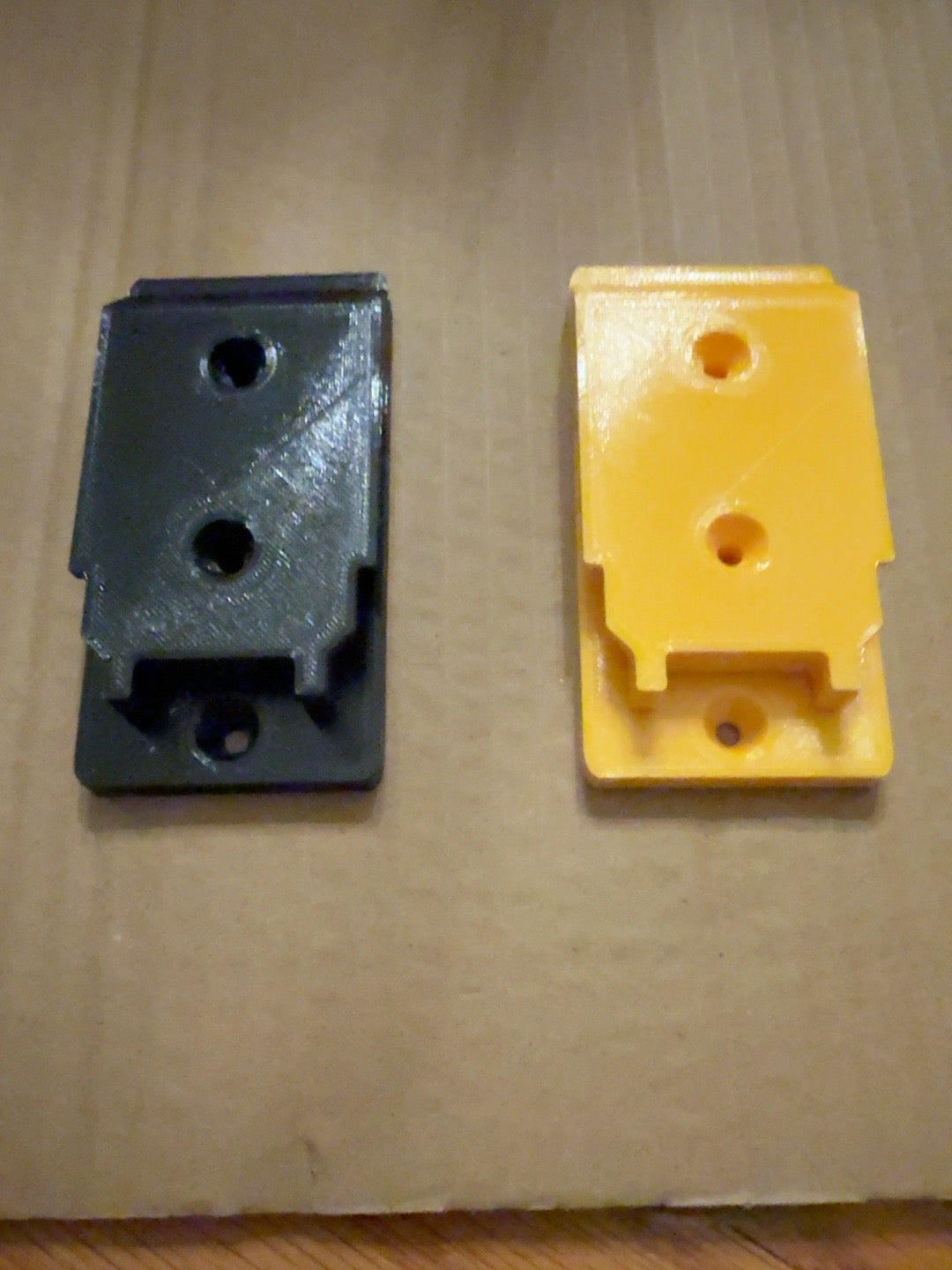Black and yellow compact PETG tool mounts compatible with DEWALT 20V MAX-style tools, front view