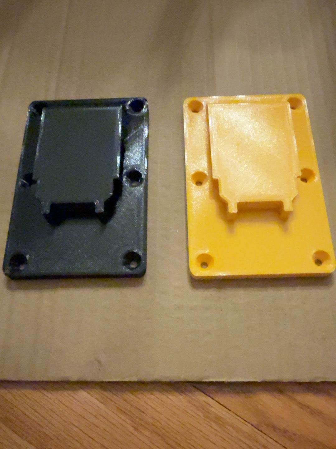 Black and yellow PETG single battery mounts compatible with DEWALT 20V MAX-style batteries, front view