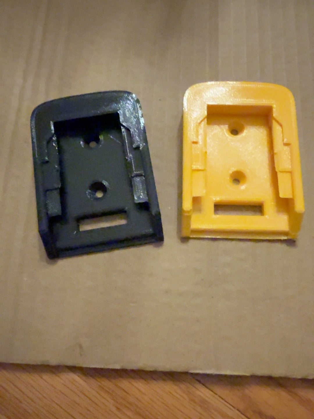 Black and yellow standard PETG tool mounts compatible with DEWALT 20V MAX-style tools, front view