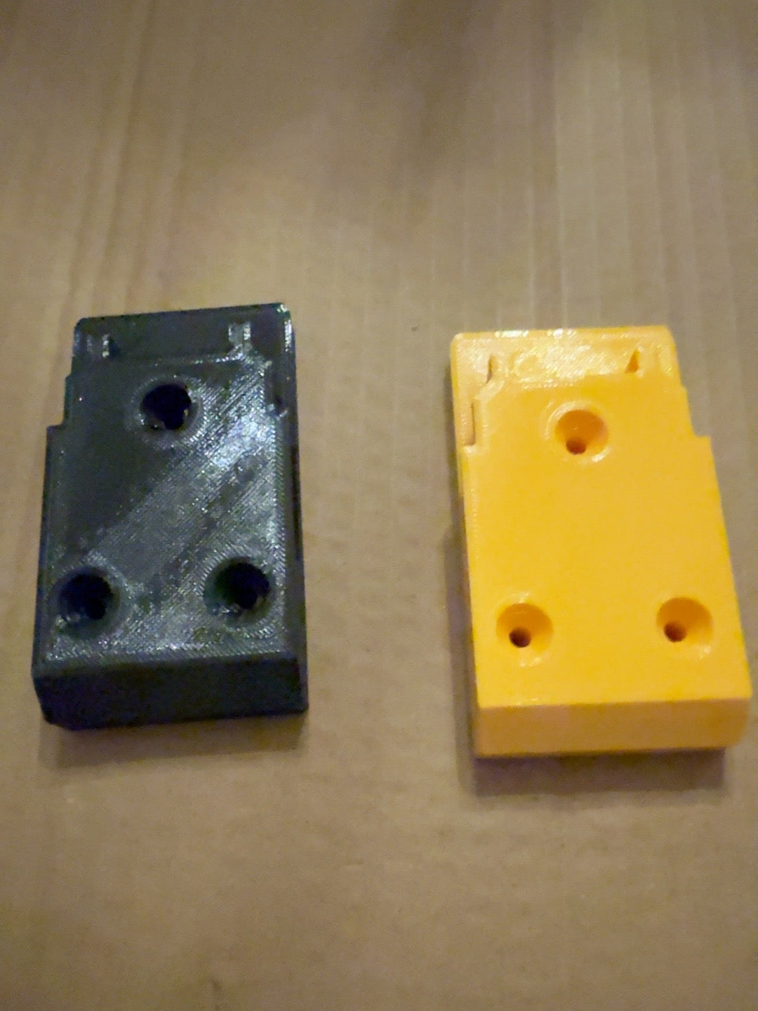 Black and yellow PETG tool mounts with clip compatible with DEWALT 20V MAX-style tools, alternate view