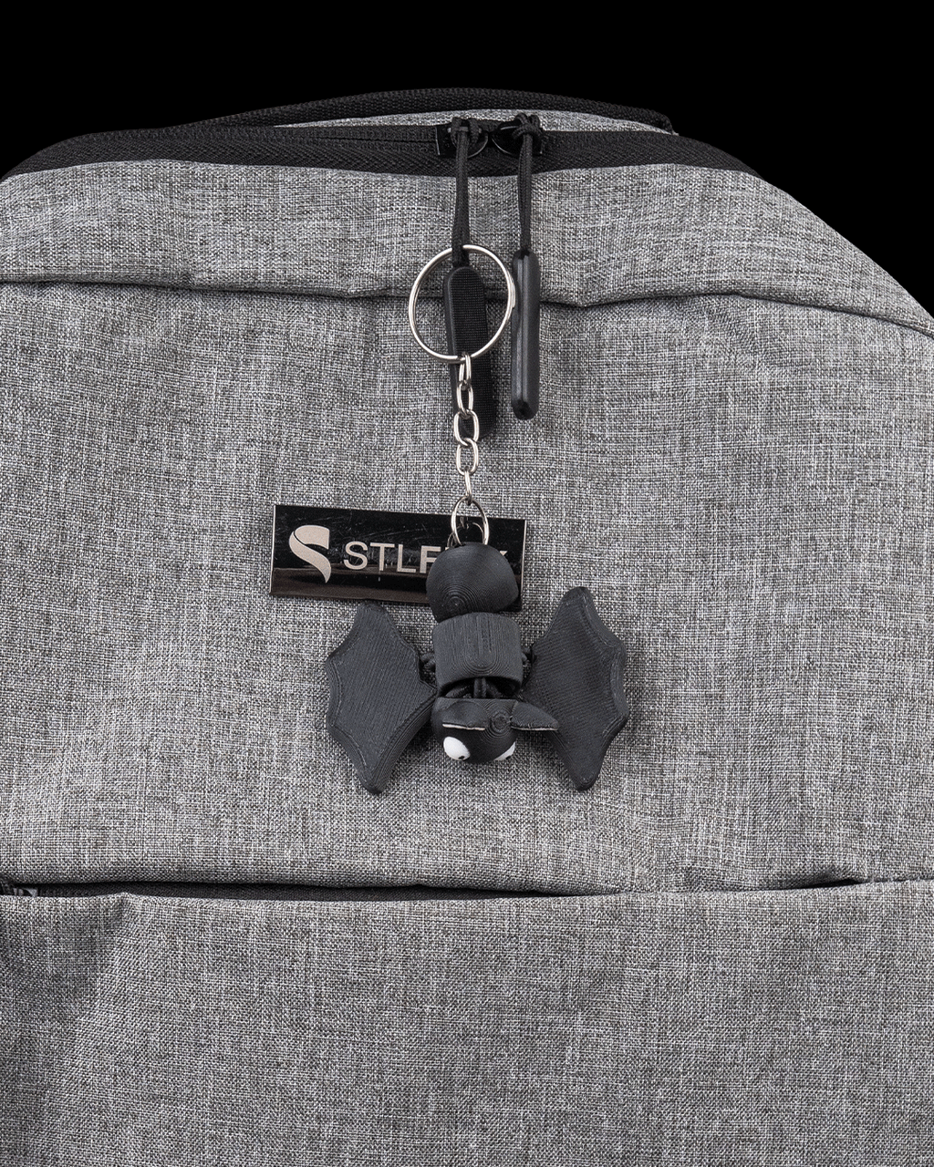 Dozy Bat 3D printed flexi bat shown as a small hanging accessory for size context
