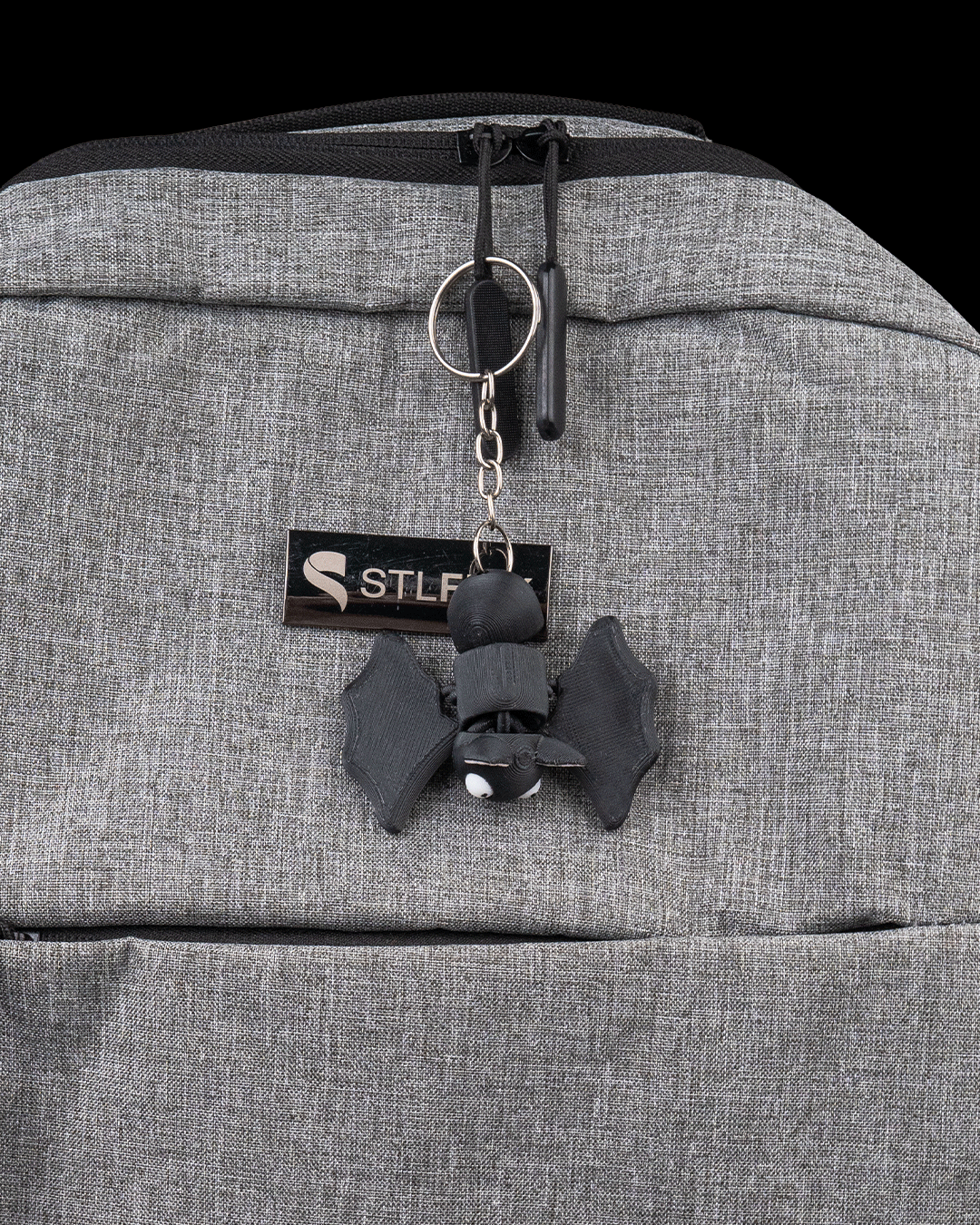 Dozy Bat 3D printed flexi bat shown as a small hanging accessory for size context