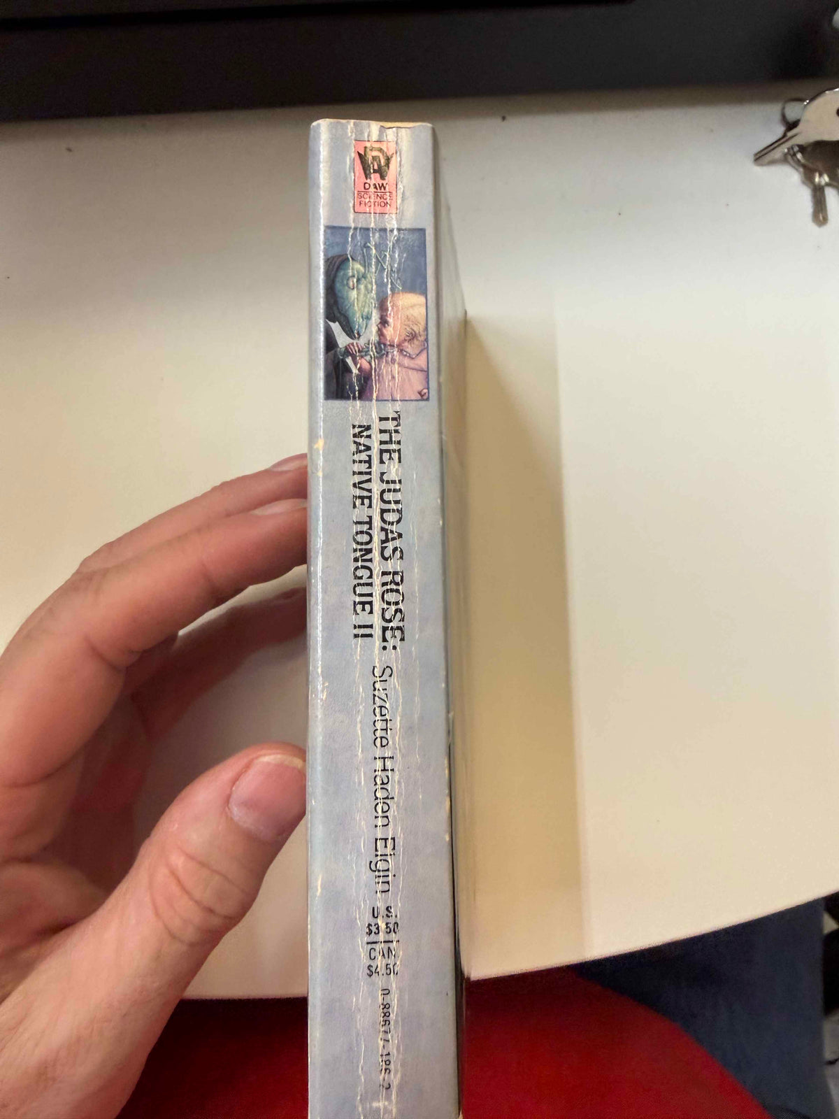 Actual copy spine showing substantial creasing