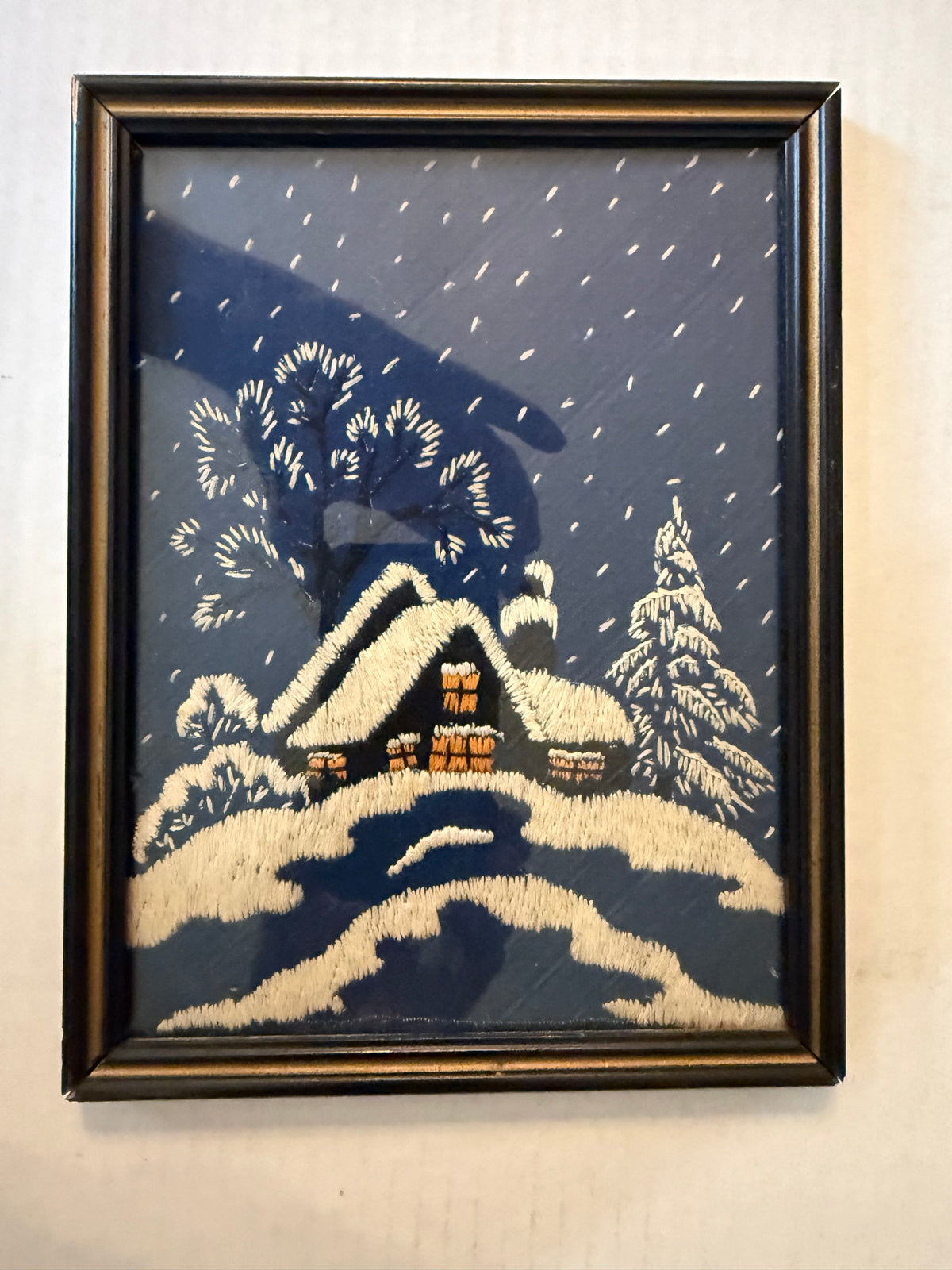Framed Snowy Cottage Scene | Navy Blue Winter Embroidery Art front photograph