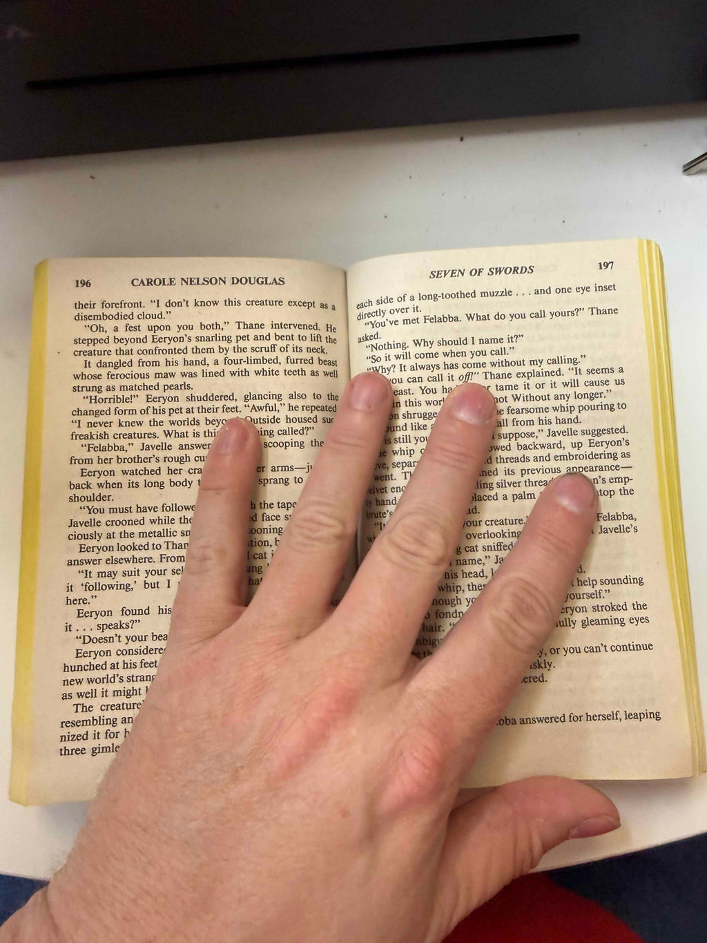 Actual interior pages of Seven of Swords showing yellowing