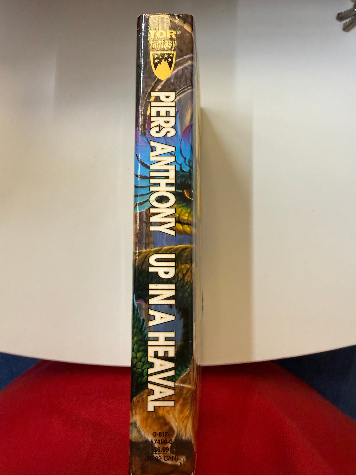Spine of actual used Up in a Heaval showing cover creasing