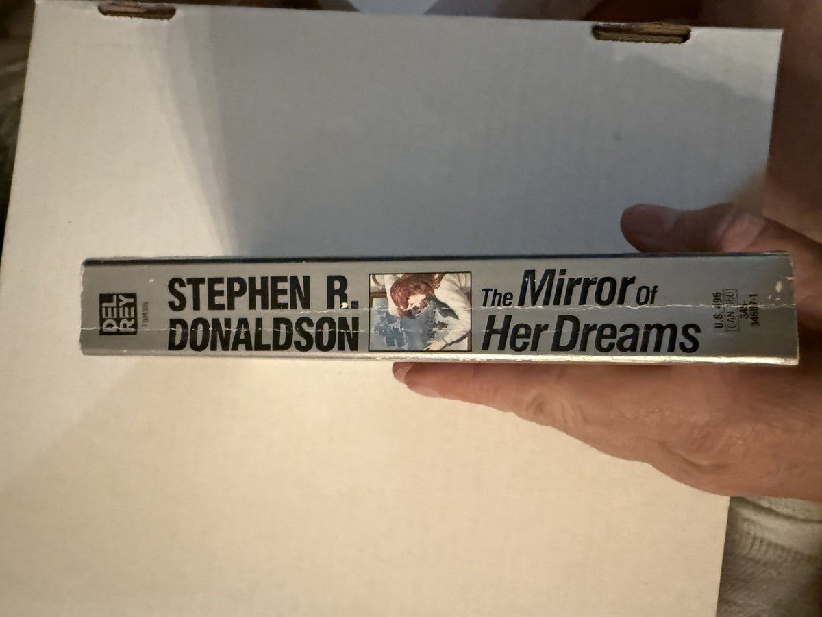Actual spine photo of The Mirror of Her Dreams