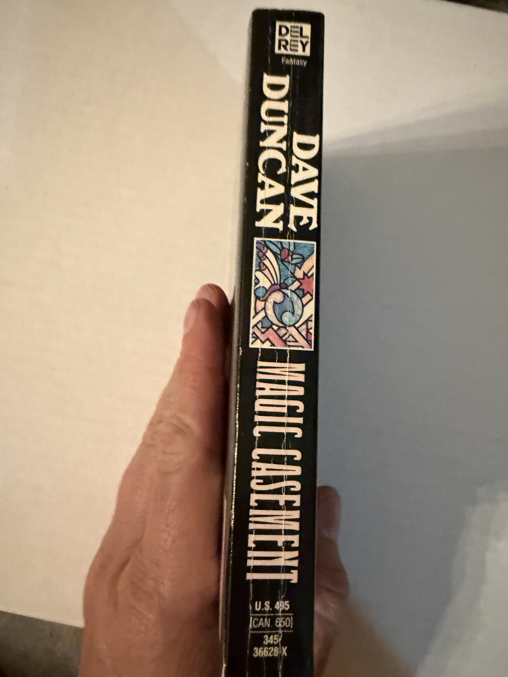 Actual spine photo of Magic Casement